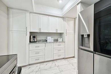 Welcome to your dream home in the prestigious Cypress Clusters on Carrollwood Country Club in Florida - for sale on GolfHomes.com, golf home, golf lot