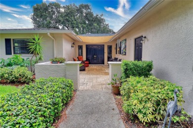 This home is a Head Turner, You are welcomed by the grand double on Palm Aire Country Club of Sarasota in Florida - for sale on GolfHomes.com, golf home, golf lot