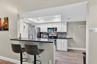 Discover low-maintenance Florida living in this beautifully on Seven Springs Golf and Country Club in Florida - for sale on GolfHomes.com, golf home, golf lot