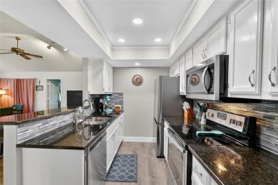 Discover low-maintenance Florida living in this beautifully on Seven Springs Golf and Country Club in Florida - for sale on GolfHomes.com, golf home, golf lot