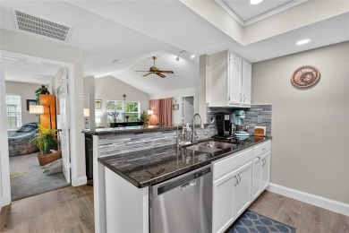 Discover low-maintenance Florida living in this beautifully on Seven Springs Golf and Country Club in Florida - for sale on GolfHomes.com, golf home, golf lot