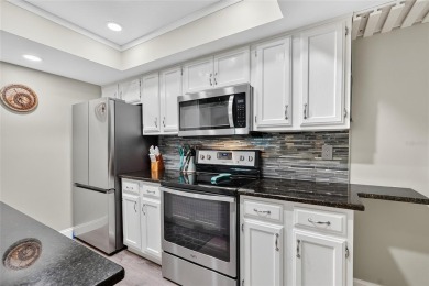 Discover low-maintenance Florida living in this beautifully on Seven Springs Golf and Country Club in Florida - for sale on GolfHomes.com, golf home, golf lot