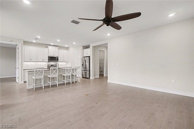 GOLF COURSE HOME WITH NO CARPET, IMPACT WINDOWS, AND 2.5-CAR on Herons Glen Golf and Country Club in Florida - for sale on GolfHomes.com, golf home, golf lot