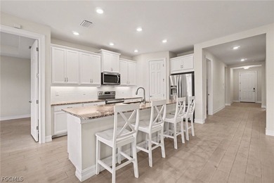 GOLF COURSE HOME WITH NO CARPET, IMPACT WINDOWS, AND 2.5-CAR on Herons Glen Golf and Country Club in Florida - for sale on GolfHomes.com, golf home, golf lot