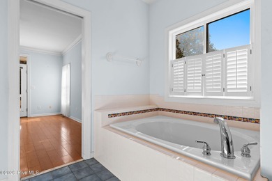 Welcome to 597 Riverwood Dr in Winding River Plantation! This on Carolina National Golf Club in North Carolina - for sale on GolfHomes.com, golf home, golf lot