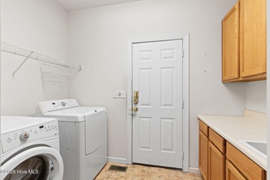 Welcome to 597 Riverwood Dr in Winding River Plantation! This on Carolina National Golf Club in North Carolina - for sale on GolfHomes.com, golf home, golf lot