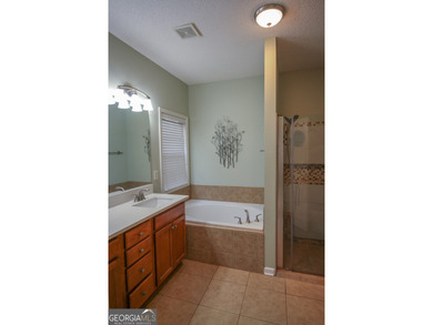 PRICE IMPROVEMENT. Open and airy floor plan in a sought after on Summergrove Golf Club in Georgia - for sale on GolfHomes.com, golf home, golf lot