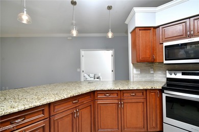 Nestled within a gated semi-private golf community, this twin on Westminster Golf Club in Florida - for sale on GolfHomes.com, golf home, golf lot