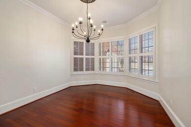 Wake up to shimmering water views in this stunning waterfront on Players Course At Wyboo Plantation in South Carolina - for sale on GolfHomes.com, golf home, golf lot