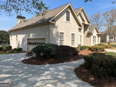 Exquisite 4-bedroom, 3.5-bathroom residence nestled within the on Lake Spivey Golf Club in Georgia - for sale on GolfHomes.com, golf home, golf lot