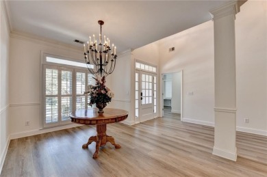 Discover a meticulously designed home that seamlessly blends on Canongate At Olde Atlanta Golf Club in Georgia - for sale on GolfHomes.com, golf home, golf lot
