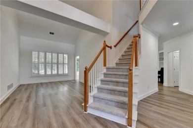 Discover a meticulously designed home that seamlessly blends on Canongate At Olde Atlanta Golf Club in Georgia - for sale on GolfHomes.com, golf home, golf lot