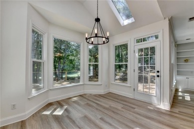 Discover a meticulously designed home that seamlessly blends on Canongate At Olde Atlanta Golf Club in Georgia - for sale on GolfHomes.com, golf home, golf lot