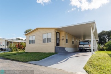 Step into this beautifully maintained 2-bedroom, 2-bath mobile on Vero Beach Country Club in Florida - for sale on GolfHomes.com, golf home, golf lot