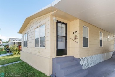 Step into this beautifully maintained 2-bedroom, 2-bath mobile on Vero Beach Country Club in Florida - for sale on GolfHomes.com, golf home, golf lot