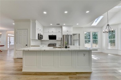 Discover a meticulously designed home that seamlessly blends on Canongate At Olde Atlanta Golf Club in Georgia - for sale on GolfHomes.com, golf home, golf lot