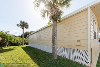 Step into this beautifully maintained 2-bedroom, 2-bath mobile on Vero Beach Country Club in Florida - for sale on GolfHomes.com, golf home, golf lot