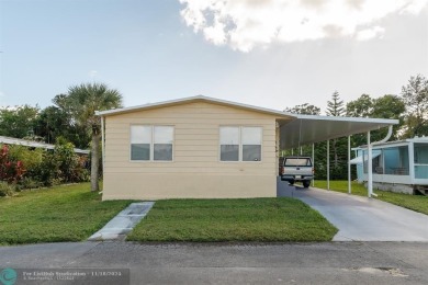 Step into this beautifully maintained 2-bedroom, 2-bath mobile on Vero Beach Country Club in Florida - for sale on GolfHomes.com, golf home, golf lot