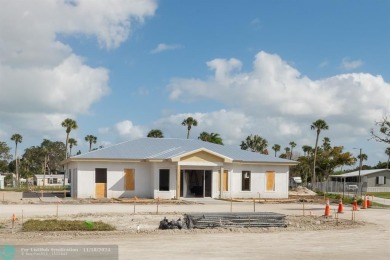 Step into this beautifully maintained 2-bedroom, 2-bath mobile on Vero Beach Country Club in Florida - for sale on GolfHomes.com, golf home, golf lot