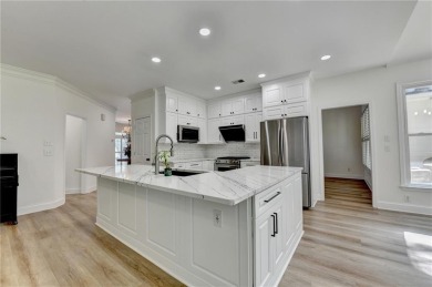 Discover a meticulously designed home that seamlessly blends on Canongate At Olde Atlanta Golf Club in Georgia - for sale on GolfHomes.com, golf home, golf lot