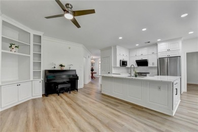 Discover a meticulously designed home that seamlessly blends on Canongate At Olde Atlanta Golf Club in Georgia - for sale on GolfHomes.com, golf home, golf lot