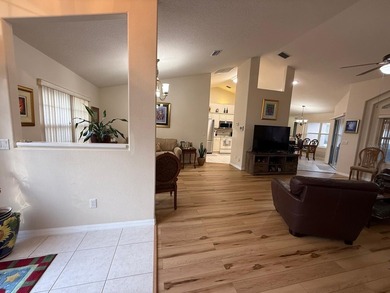 Step into this meticulously maintained three-bedroom, two-bath on The Grand Club Cypress Course in Florida - for sale on GolfHomes.com, golf home, golf lot