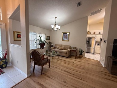 Step into this meticulously maintained three-bedroom, two-bath on The Grand Club Cypress Course in Florida - for sale on GolfHomes.com, golf home, golf lot