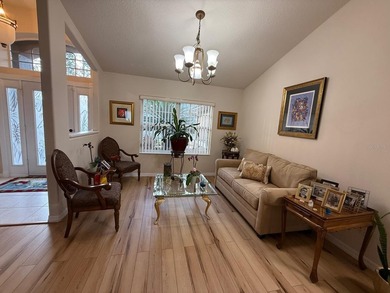 Step into this meticulously maintained three-bedroom, two-bath on The Grand Club Cypress Course in Florida - for sale on GolfHomes.com, golf home, golf lot