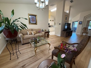 Step into this meticulously maintained three-bedroom, two-bath on The Grand Club Cypress Course in Florida - for sale on GolfHomes.com, golf home, golf lot