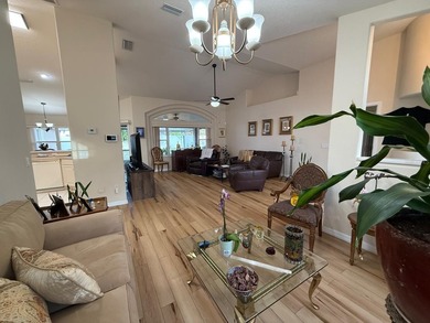 Step into this meticulously maintained three-bedroom, two-bath on The Grand Club Cypress Course in Florida - for sale on GolfHomes.com, golf home, golf lot