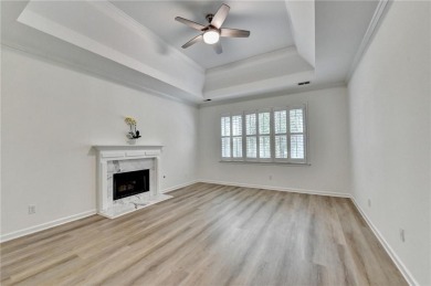 Discover a meticulously designed home that seamlessly blends on Canongate At Olde Atlanta Golf Club in Georgia - for sale on GolfHomes.com, golf home, golf lot