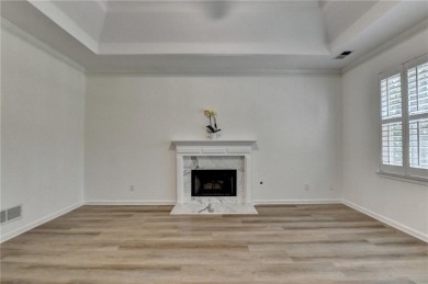 Discover a meticulously designed home that seamlessly blends on Canongate At Olde Atlanta Golf Club in Georgia - for sale on GolfHomes.com, golf home, golf lot