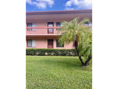 Welcome to this stunning 2-bedroom, 2-bathroom first-floor condo on East Lake Woodlands Country Club in Florida - for sale on GolfHomes.com, golf home, golf lot