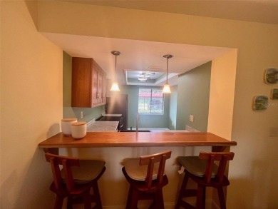Welcome to this stunning 2-bedroom, 2-bathroom first-floor condo on East Lake Woodlands Country Club in Florida - for sale on GolfHomes.com, golf home, golf lot