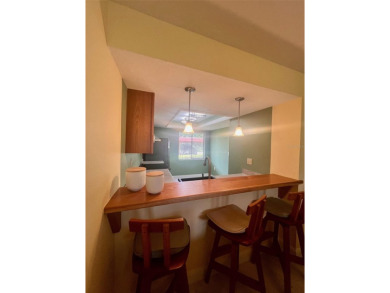 Welcome to this stunning 2-bedroom, 2-bathroom first-floor condo on East Lake Woodlands Country Club in Florida - for sale on GolfHomes.com, golf home, golf lot