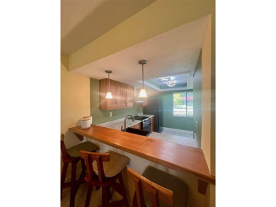 Welcome to this stunning 2-bedroom, 2-bathroom first-floor condo on East Lake Woodlands Country Club in Florida - for sale on GolfHomes.com, golf home, golf lot