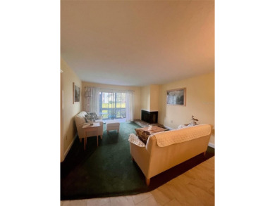 Welcome to this stunning 2-bedroom, 2-bathroom first-floor condo on East Lake Woodlands Country Club in Florida - for sale on GolfHomes.com, golf home, golf lot