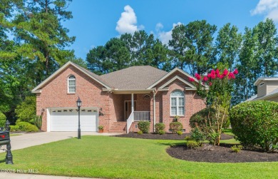 Nestled in a prestigious gated golf community, this brick home on Brunswick Plantation and Golf Resorts in North Carolina - for sale on GolfHomes.com, golf home, golf lot