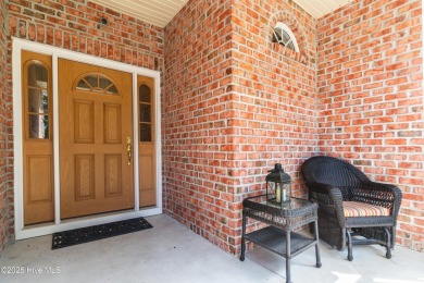 Nestled in a prestigious gated golf community, this brick home on Brunswick Plantation and Golf Resorts in North Carolina - for sale on GolfHomes.com, golf home, golf lot
