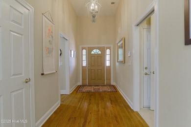 Nestled in a prestigious gated golf community, this brick home on Brunswick Plantation and Golf Resorts in North Carolina - for sale on GolfHomes.com, golf home, golf lot