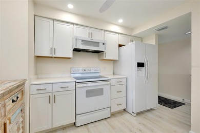 This recently renovated 2nd level end unit residence is light on Plantation Golf and Country Club in Florida - for sale on GolfHomes.com, golf home, golf lot