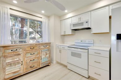 This recently renovated 2nd level end unit residence is light on Plantation Golf and Country Club in Florida - for sale on GolfHomes.com, golf home, golf lot