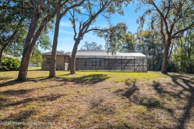 Discover the essence of Florida living in this charming on Oak Hills Country Club in Florida - for sale on GolfHomes.com, golf home, golf lot