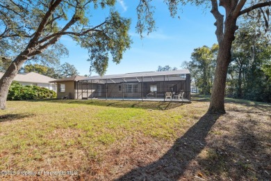 Discover the essence of Florida living in this charming on Oak Hills Country Club in Florida - for sale on GolfHomes.com, golf home, golf lot