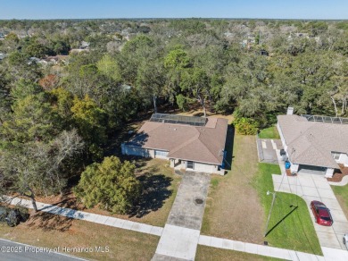 Discover the essence of Florida living in this charming on Oak Hills Country Club in Florida - for sale on GolfHomes.com, golf home, golf lot