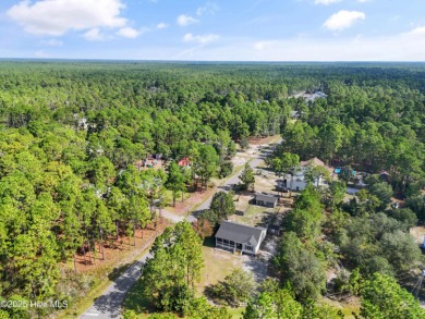 This meticulously maintained 3-bedroom, 2-bath ranch sits on a on The Lakes Country Club in North Carolina - for sale on GolfHomes.com, golf home, golf lot