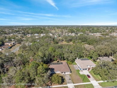 Discover the essence of Florida living in this charming on Oak Hills Country Club in Florida - for sale on GolfHomes.com, golf home, golf lot