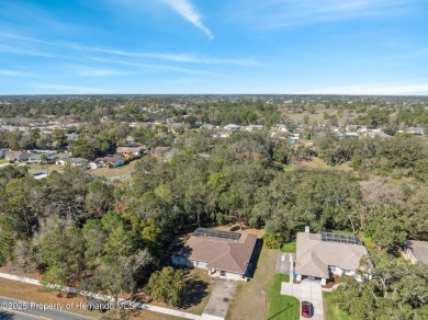 Discover the essence of Florida living in this charming on Oak Hills Country Club in Florida - for sale on GolfHomes.com, golf home, golf lot