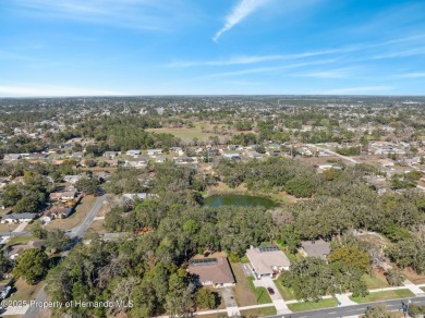 Discover the essence of Florida living in this charming on Oak Hills Country Club in Florida - for sale on GolfHomes.com, golf home, golf lot