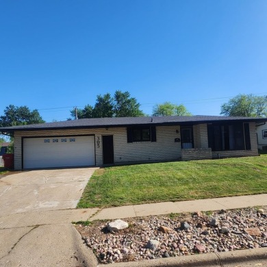 Discover comfort and convenience in this charming brick ranch on Hillcrest Golf and Country Club in South Dakota - for sale on GolfHomes.com, golf home, golf lot